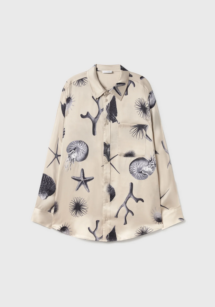 Beige shirt with black starfish pattern on a white background