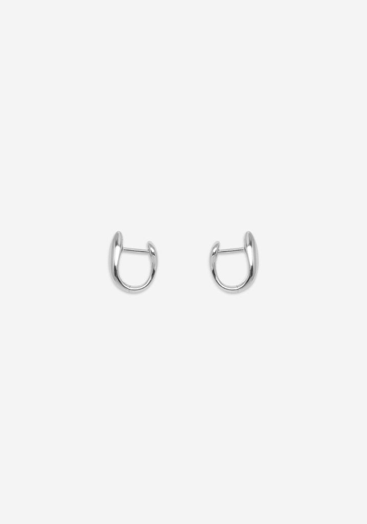 Nina Gordon Debut Hoops Silver huggie earrings on white background
