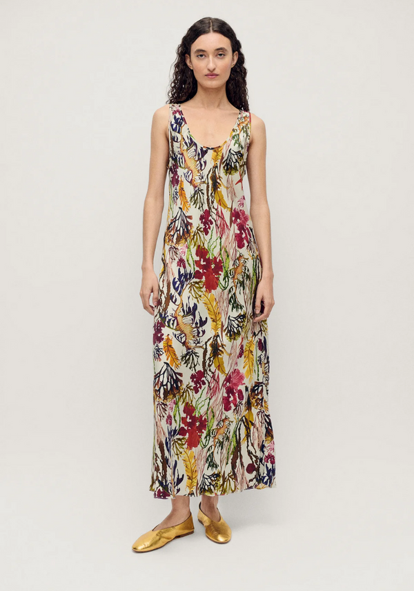 Woman wearing a floral dress on a white background